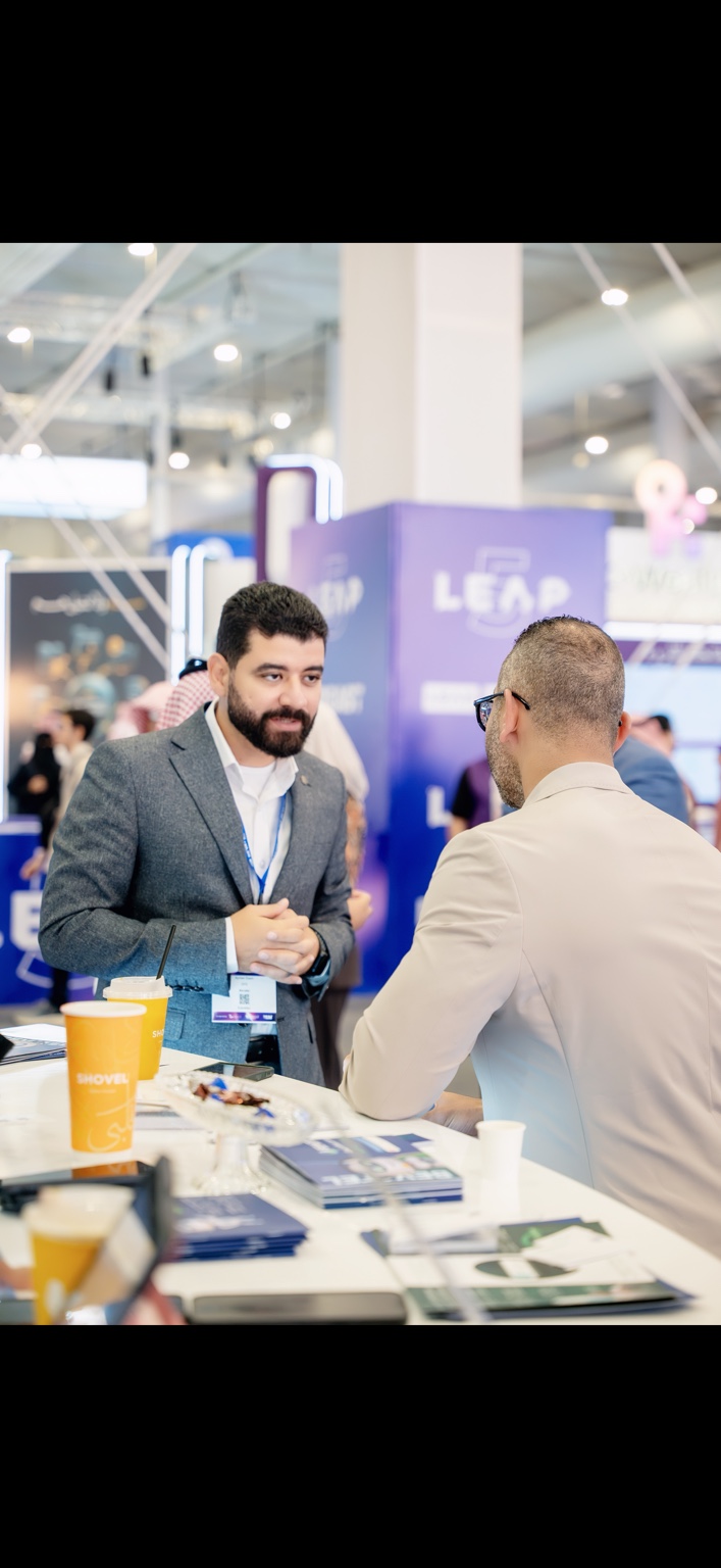 Ayman Esam in a business discussion at LEAP 2026
